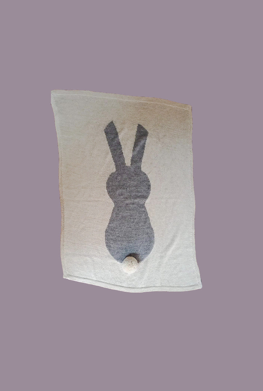 Grey bunny on beige